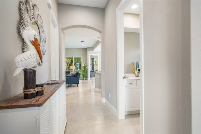 hallway with light tile patterned flooring