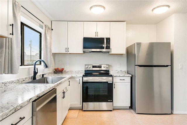 kitchen featuring white cabinetry, sink, and appliances with stainless steel finishes