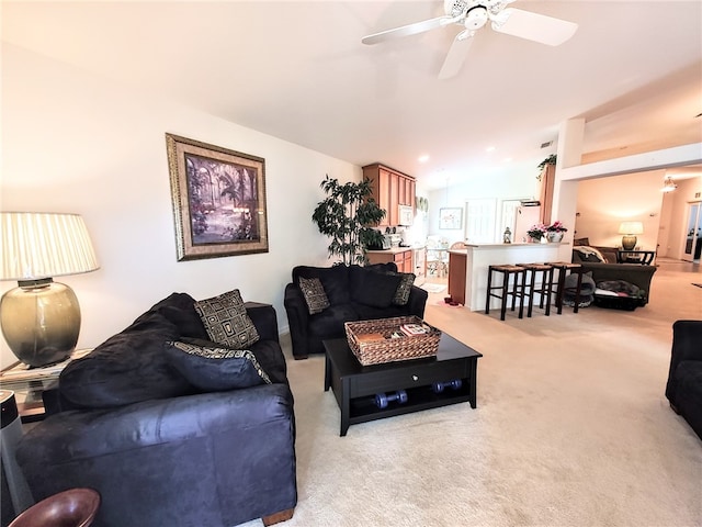 living room featuring light carpet, ceiling fan, and lofted ceiling