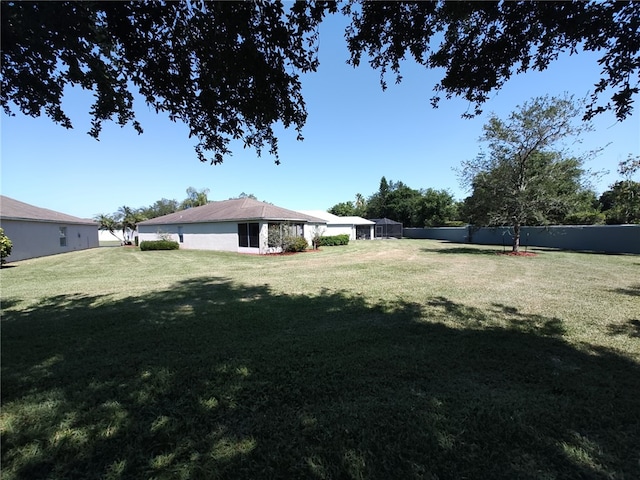 view of yard with a lanai