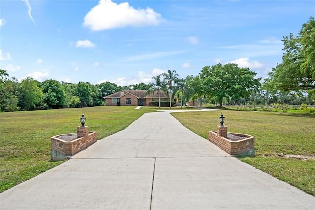 view of home's community featuring a lawn