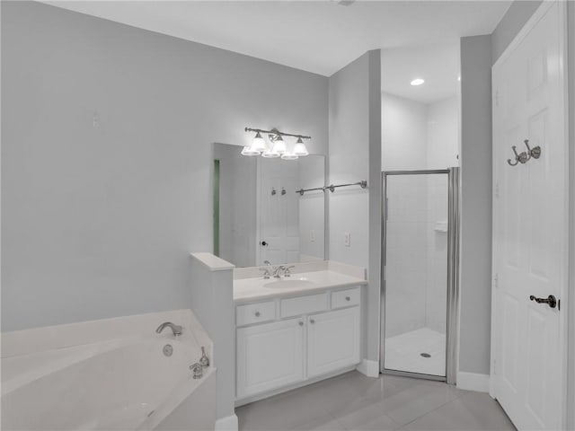 bathroom featuring vanity, tile patterned flooring, and separate shower and tub