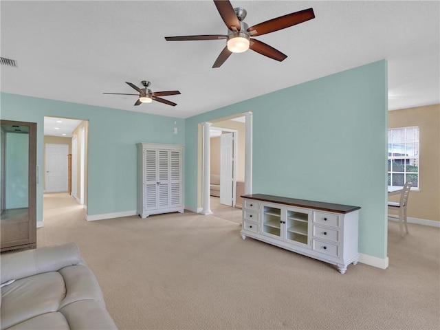 carpeted living room featuring ceiling fan