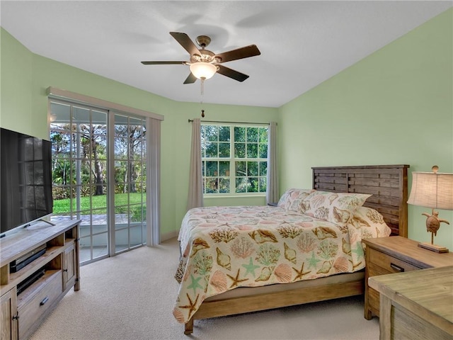 carpeted bedroom with multiple windows, access to exterior, and ceiling fan