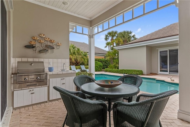 exterior space featuring sink, exterior kitchen, a patio area, and area for grilling