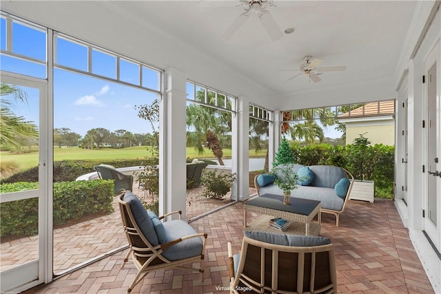 sunroom / solarium featuring ceiling fan and plenty of natural light