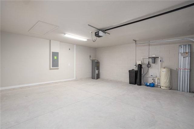901 Brickell St SE, Palm Bay, FL 32909 - garage featuring electric panel, water heater, concrete block wall, and a garage door opener
