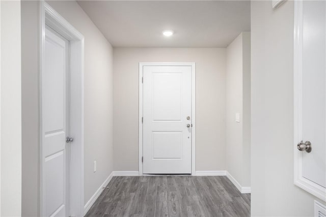 901 Brickell St SE, Palm Bay, FL 32909 - doorway featuring wood finished floors and recessed lighting