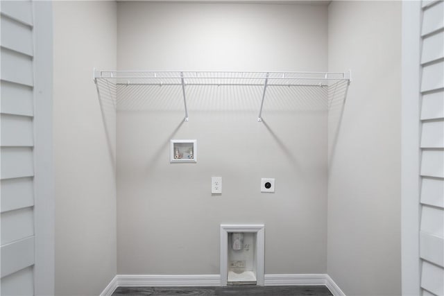 901 Brickell St SE, Palm Bay, FL 32909 - laundry area with hookup for an electric dryer, hookup for a washing machine, and wood finished floors