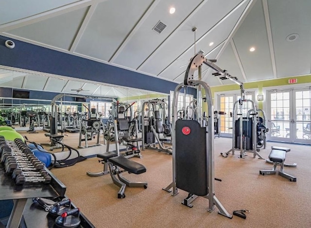 exercise room with ceiling fan and vaulted ceiling