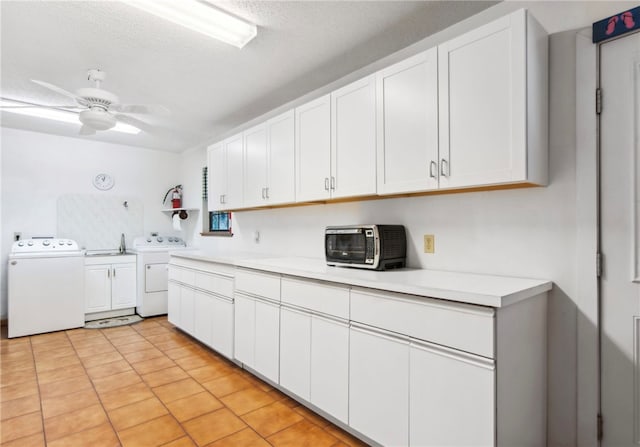 kitchen with a textured ceiling, ceiling fan, and white cabinets