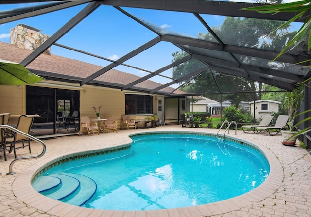 view of pool featuring a patio area and a lanai