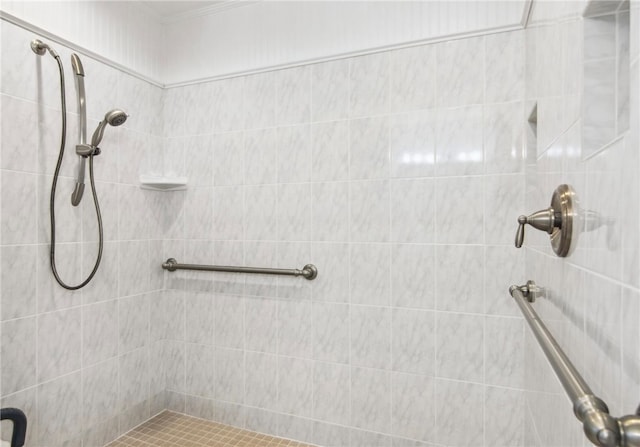 bathroom with tiled shower