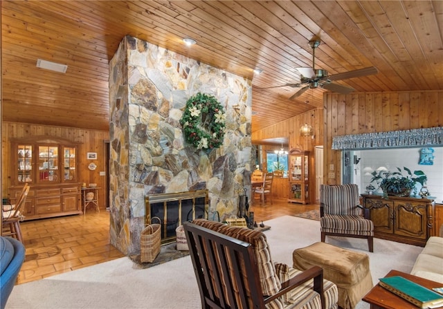 living room with wood walls, wood ceiling, and vaulted ceiling