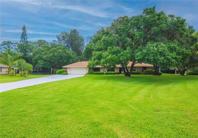 view of front facade featuring a front lawn and a garage