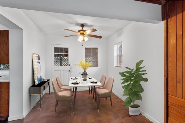 dining space with ceiling fan