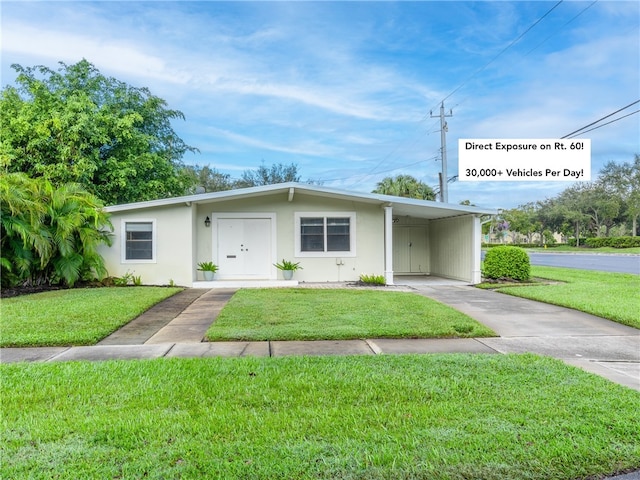 single story home with a carport and a front yard