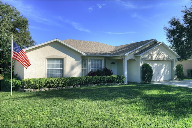 single story home with a front yard and a garage