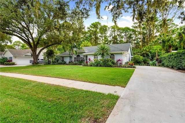 single story home with a front lawn