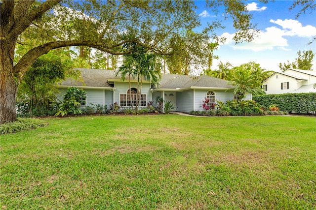 single story home featuring a front yard