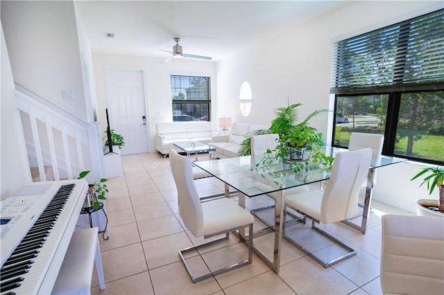 dining room featuring ceiling fan and light tile patterned flooring