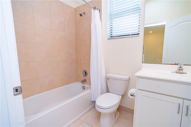 full bathroom featuring tile patterned flooring, shower / bath combo, vanity, and toilet