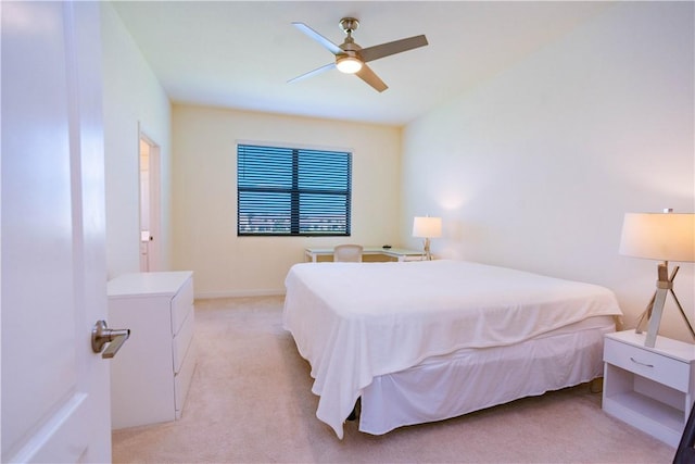 bedroom featuring ceiling fan and light carpet