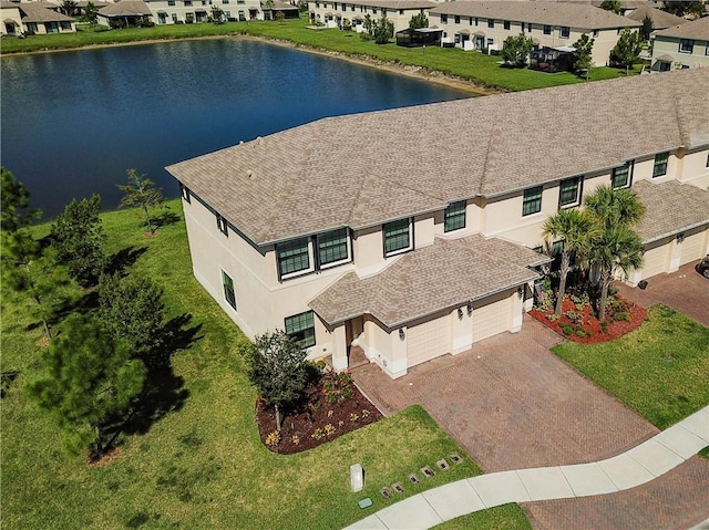 bird's eye view with a water view