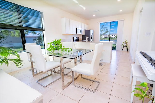 tiled dining room with sink