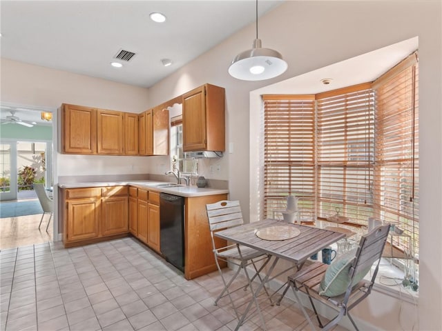 kitchen featuring sink, ceiling fan, black dishwasher, decorative light fixtures, and light tile patterned flooring