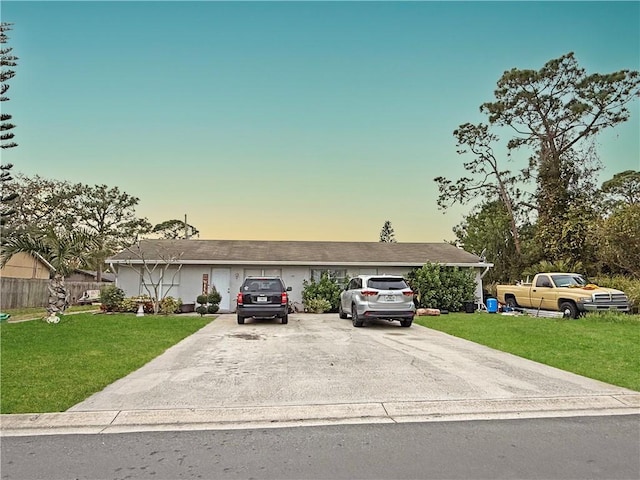 ranch-style house with a lawn