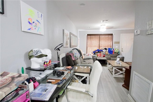 office area with light hardwood / wood-style flooring