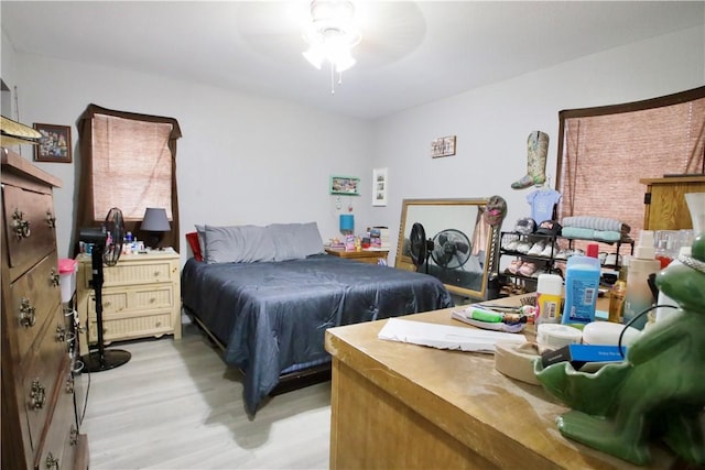 bedroom featuring ceiling fan and light hardwood / wood-style floors