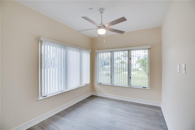 unfurnished room featuring ceiling fan and light hardwood / wood-style flooring