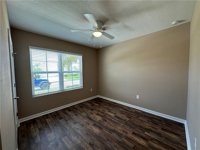 3315 Rockport St SW, Vero Beach, FL 32968 - empty room with dark wood-style flooring, ceiling fan, a textured ceiling, and a smoke detector