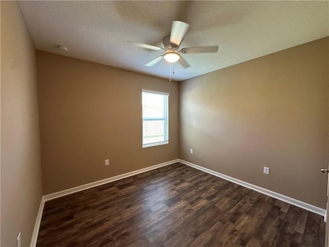 3315 Rockport St SW, Vero Beach, FL 32968 - spare room with dark wood-style flooring, a ceiling fan, and a textured ceiling