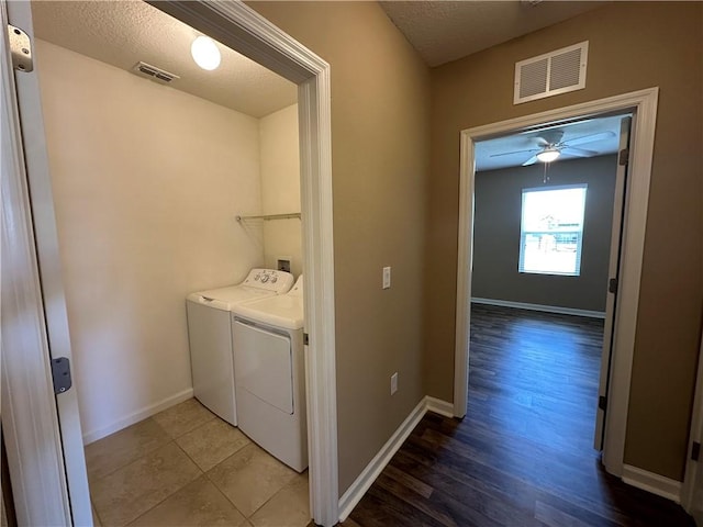 3315 Rockport St SW, Vero Beach, FL 32968 - washroom featuring washer and dryer, light wood-style floors, ceiling fan, and a textured ceiling