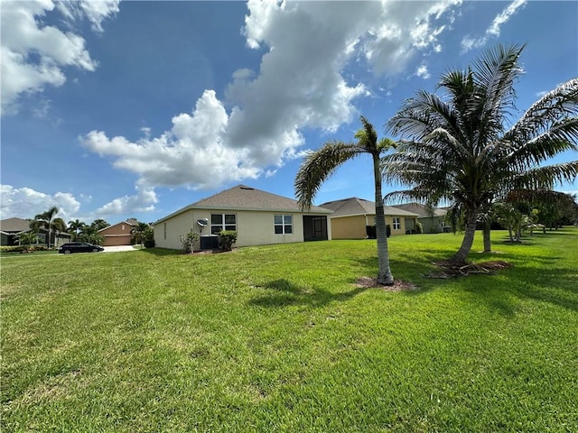 3315 Rockport St SW, Vero Beach, FL 32968 - back of house with a yard