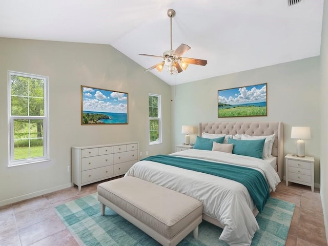 bedroom with ceiling fan, lofted ceiling, and light tile patterned floors