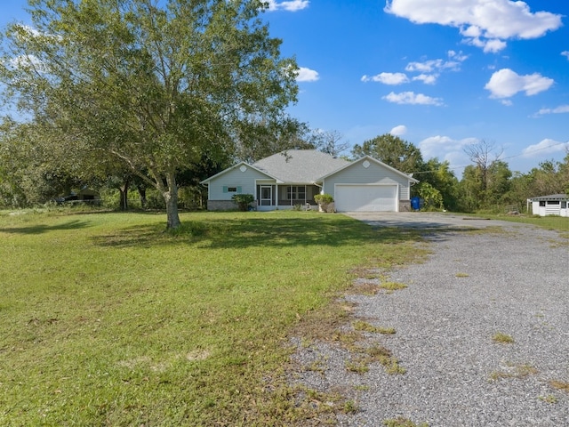 single story home with a garage and a front yard