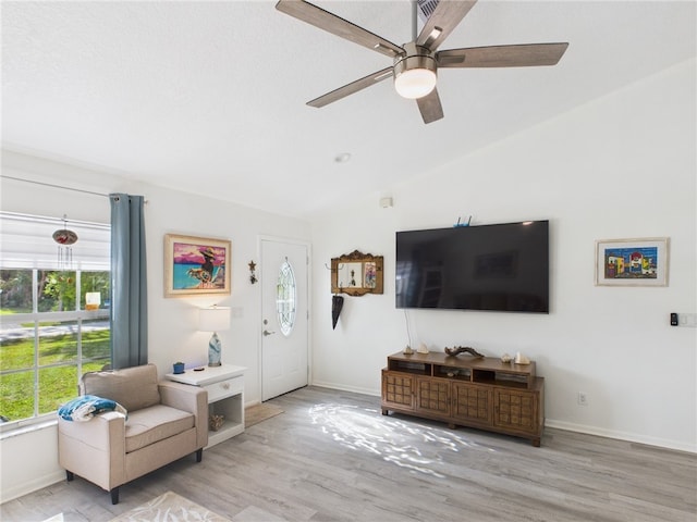7965 105th Ave, Vero Beach, FL 32967 - living room with wood finished floors, lofted ceiling, ceiling fan, and baseboards