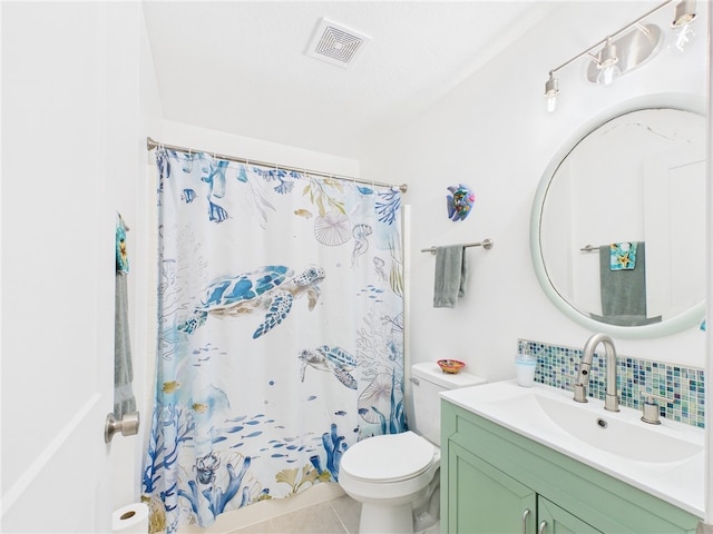 7965 105th Ave, Vero Beach, FL 32967 - bathroom featuring vanity, tasteful backsplash, toilet, tile patterned floors, and a shower with shower curtain