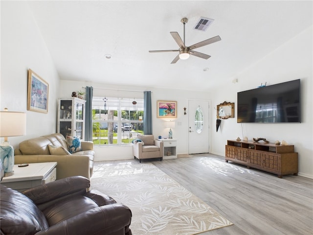 7965 105th Ave, Vero Beach, FL 32967 - living area featuring lofted ceiling, ceiling fan, wood finished floors, and baseboards