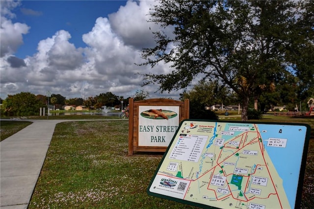 view of property's community with a yard