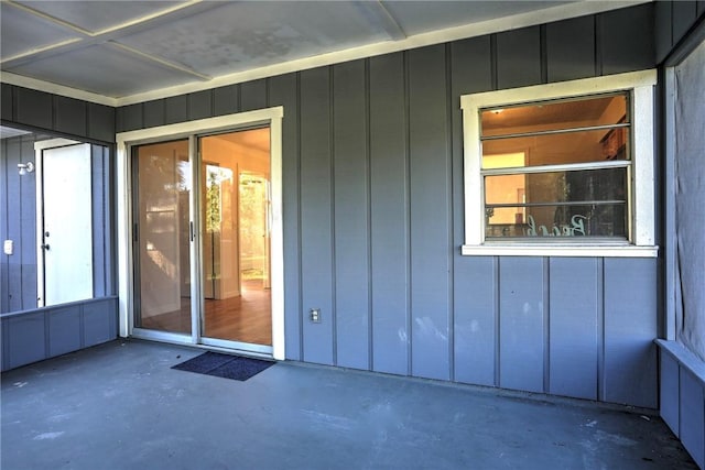 doorway to property with board and batten siding