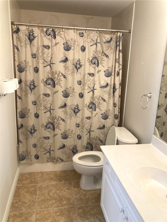 full bath with tile patterned floors, toilet, vanity, and shower / bath combo