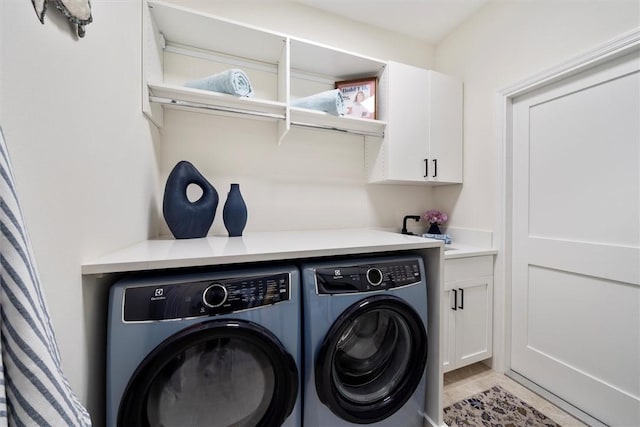 1715 N Orchid Island Cir, Vero Beach, FL 32963 - laundry room featuring cabinet space and independent washer and dryer