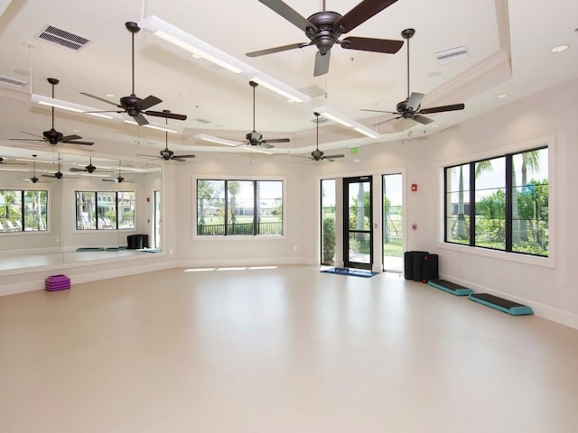 interior space featuring recessed lighting, a raised ceiling, visible vents, and baseboards