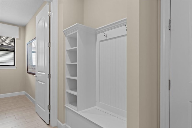 mudroom with light wood-style flooring and baseboards