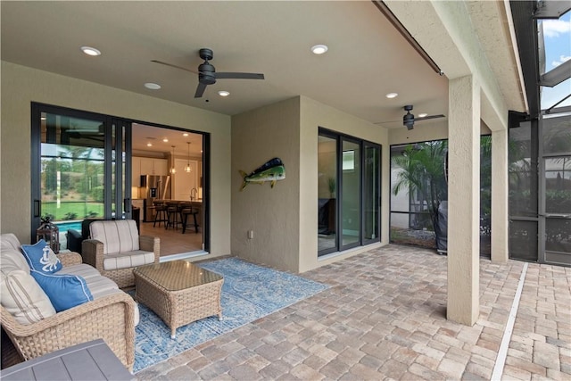 view of patio featuring a ceiling fan and an outdoor hangout area